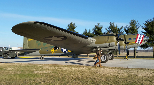 The restored B-17F Memphis Belle is moved to a hangar at the National Museum of the United States Air Force in Dayton, Ohio. The Belle’s nose art is covered with bunting before its official unveiling. (US Air Force)